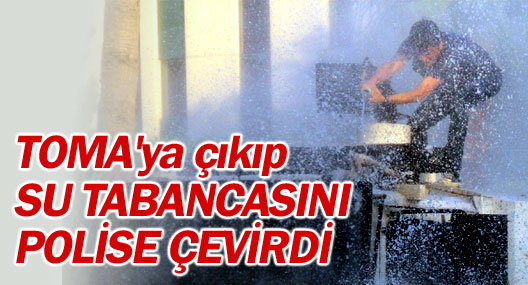 Gösterici TOMA’ya çıkıp su tabancasını polise çevirdi