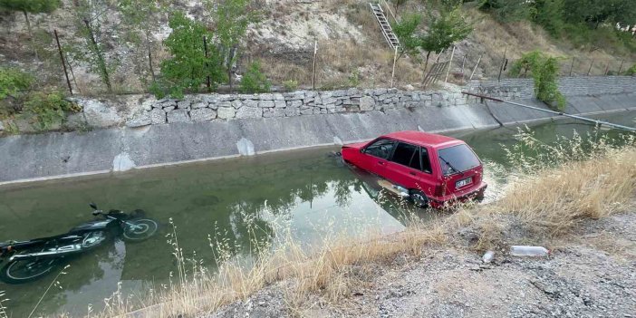 Malaya'da yol verme kavgası sonrası yaşanan kazada araçlar sulama kanalına uçtu